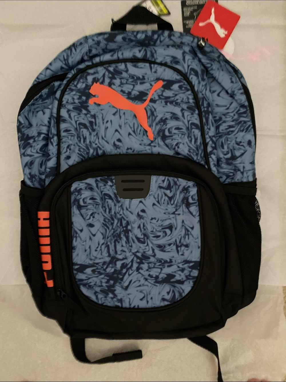 Puma Blue Marble Backpack with Orange Logo and Black Accents